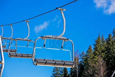 empty ski lift against the blue sky. Active recreation