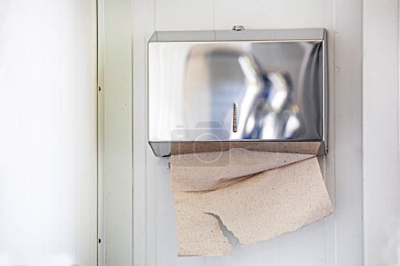Photo for Paper napkins for hands and face in the toilet room - Royalty Free Image