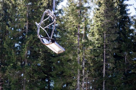 walking observation chair on a ski lift in the middle of the forest. leisure