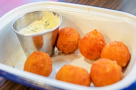 cheese balls with garlic sauce in a cafe