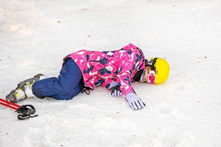 young skier is resting on a ski slope. Active recreation. Healthy lifestyle