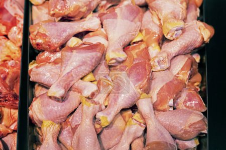 pieces of chopped poultry meat on the counter in a store. Top view, diet