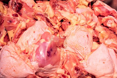 raw pieces of chopped poultry meat on the counter in a store. Top view, diet