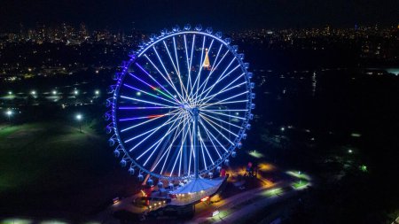 Photo for SO PAULO, BRAZIL DECEMBER 26, 2022 Aerial Photography Aerial view of the largest Ferris wheel in Latin America. Officially called Roda Rico, it is working in Parque Cndido Portinari, next to Parque Villa-Lobos, in So Paulo. - Royalty Free Image