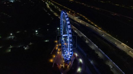 Photo for SO PAULO, BRAZIL DECEMBER 26, 2022 Aerial Photography Aerial view of the largest Ferris wheel in Latin America. Officially called Roda Rico, it is working in Parque Cndido Portinari, next to Parque Villa-Lobos, in So Paulo. - Royalty Free Image