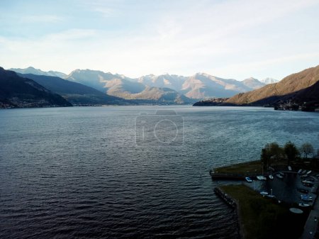 Photo for A beautiful view across the water with coastal landscape scenery changing along the Inside Italy, Lake Como on cruise vacation. High quality photo - Royalty Free Image