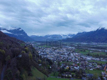 Photo for The view from above Interlaken, Switzerland. Looking forward the Swiss Alps and this beautiful town carved through the snow capped mountain peaks. High quality photo - Royalty Free Image