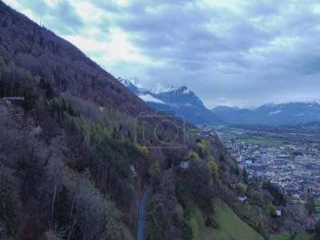 The view from above Interlaken, Switzerland. Looking forward the Swiss Alps and this beautiful town carved through the snow capped mountain peaks. High quality photo