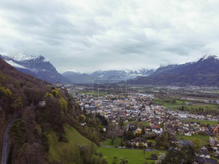 The view from above Interlaken, Switzerland. Looking forward the Swiss Alps and this beautiful town carved through the snow capped mountain peaks. High quality photo