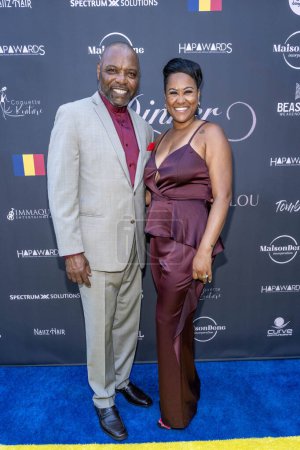 Photo for Bailiff Petri Hawkins-Byrd with wife Makita Bond attends Black-Tie Dinner Party In Honor of Her Excellency Kitoko Gata Ngoulou, Ambassador of Chad at home of Phil Westbrooks, Los Angeles, CA July 21, 2023 - Royalty Free Image