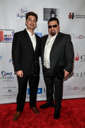 Photo for Heart Transplant receiver  Ricky Oropeza with son Freddy attends OneLegacy Annual Ava's Heart Award Gala at The Taglyan Complex, Los Angeles, CA August 24, 2023 - Royalty Free Image