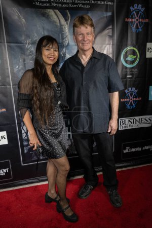 Photo for Grandmaster David L Reed with Lady Lallaine Reed attends Los Angeles Film Premiere BENEATH US ALL at Laemmles Town Center 5, Los Angeles, CA September 14th, 2023 - Royalty Free Image