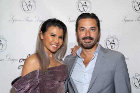 Photo for Fashion Night LA owner Brad Thomas and CFO Ly White attend Couture Designer Symone Prince presents her latest collection for VIPs at The Britely , Los Angeles, CA October  19, 2023 - Royalty Free Image