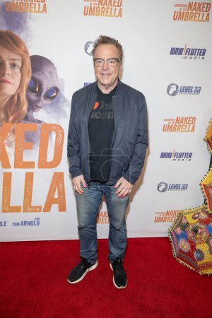 Photo for Actor comedian Tom Arnold attends World Premiere of the Adventures Of The Naked Umbrella at Regency Village Theatre in Westwood, Los Angeles, CA November  9, 2023 - Royalty Free Image