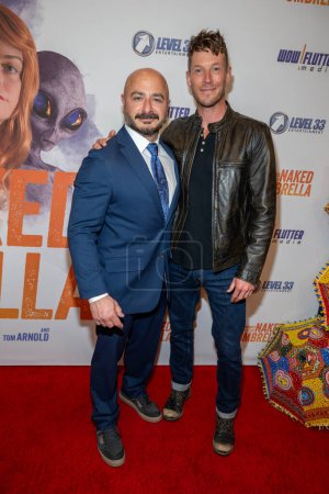 Photo for Actor, co-producer Bert Rotundo, Actor Chad Michael Collins attends World Premiere of the Adventures Of The Naked Umbrella at Regency Village Theatre in Westwood, Los Angeles, CA November  9, 2023 - Royalty Free Image