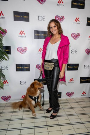 Photo for Actress Courtney Moore with her dog actor Henry attends Max Events Presents Models of Comedy at SIXTY Beverly Hills, Los Angeles, CA November 17, 2023 - Royalty Free Image