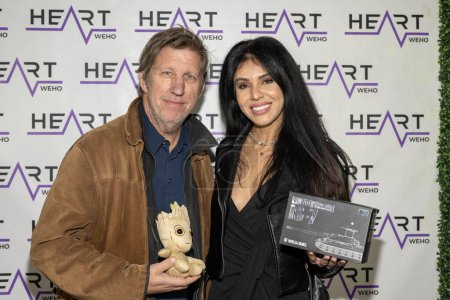 Photo for Actor Robert Peters, Actress Tugba Ercan attend J. Michael Arnoldi Birthday Bash and Toy Drive featuring Performance of G Tom Mac at Heart WeHo Night club in West Hollywood, Los Angeles, CA December 9, 2023 - Royalty Free Image