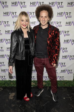 Photo for Actress Kendall Evans, Actor Josh Sussman attend J. Michael Arnoldi Birthday Bash and Toy Drive featuring Performance of G Tom Mac at Heart WeHo Night club in West Hollywood, Los Angeles, CA December 9, 2023 - Royalty Free Image