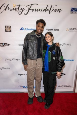 Photo for Artist/Influencer KingCarlX , Singer Sierra Fisher attend 2023 Christy's Foundation distributed toys to underserved children for holiday at Footbuddys in Glendale Galleria, Los Angeles, CA December 9, 2023 - Royalty Free Image