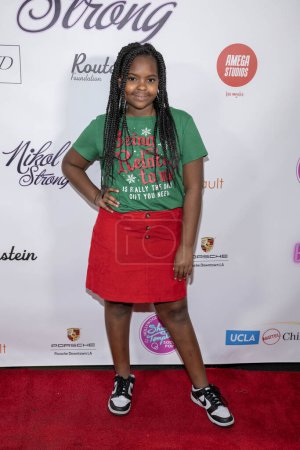 Photo for Actress Alyssa Harris attends Toys Charity Night and Nikol Strong's Birthday Party at Porsche Downtown, Los Angeles, CA December 17th, 2023 - Royalty Free Image