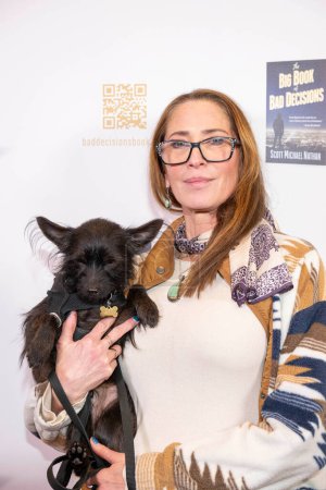 Photo for Hair Dresser Erica Reiss with dog Moses attends Scott Michael Nathan's "The Big Book of Bad Decisions" book signing at Barnes and Noble at the Grove, Los Angeles, CA, February 16th, 2024 - Royalty Free Image