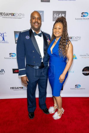Photo for CEO of Total Beauty Supply, Captain Pierre and Candice Sutton attends 2024 Annual Suzanne Delaurentiis Gala, Luncheon And Gifting Suite honoring our veterans and Celebrating The 96th Oscars at Luxe Sunset Blvd Hotel, Los Angeles, CA, March 10, 2024 - Royalty Free Image