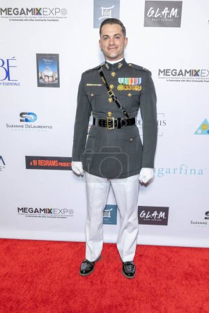 Photo for Marine Captain Tommy de Vries attends The 2024 Annual Suzanne Delaurentiis Gala, Luncheon And Gifting Suite honoring our veterans and Celebrating The 96th Oscars at Luxe Sunset Blvd Hotel, Los Angeles, CA, March 10, 2024 - Royalty Free Image