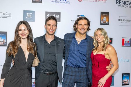 Photo for Actor Hank Northrup, Actor Chase Garland with wives attend The 2024 Annual Suzanne Delaurentiis Gala, Luncheon And Gifting Suite honoring our veterans and Celebrating The 96th Oscars at Luxe Sunset Blvd Hotel, Los Angeles, CA, March 10, 2024 - Royalty Free Image