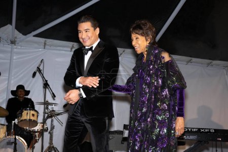 Photo for Co-host Actor Mario Lopez, Actress Marla Gibbs on stage at Children Uniting Nations 24th Annual Academy Awards Celebration and Oscars Viewing Dinner at The Historic Warner Bro. Estate, Los Angeles, CA, March 10, 2024 - Royalty Free Image