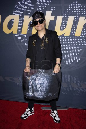 Photo for DJ Cyn with a bag designed by Robert Pho attends Children Uniting Nations 24th Annual Academy Awards Celebration and Oscars Viewing Dinner at The Historic Warner Bro. Estate, Los Angeles, CA, March 10, 2024 - Royalty Free Image