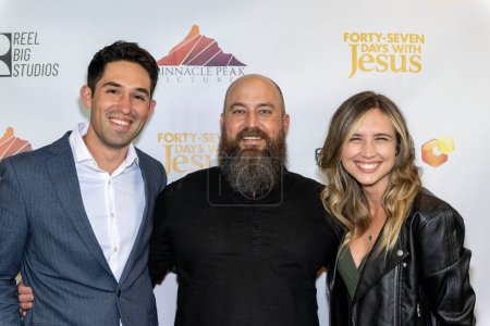 Photo for Cinematographer Brian Lang, Stunt Coordinator Andrew Staton, Producer Shelby Murphy attends Los Angeles Premiere of the film "Forty-Seven Days with Jesus" at AMC Burbank 16, Los Angeles, CA, March 11, 2024 - Royalty Free Image