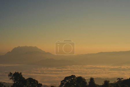 Photo for Travel and people activity concept with twilight sky before sunrise with mountain and fog on foreground - Royalty Free Image