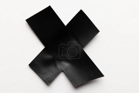 Photo for Cross shape black masking tape on white background. Abstract paper texture background and communication concept. - Royalty Free Image