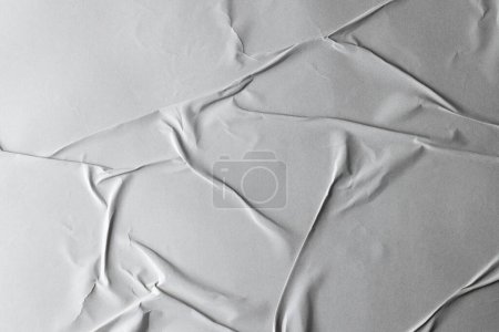 Corrugated pieces of white paper on white background. Abstract paper texture background and communication concept.