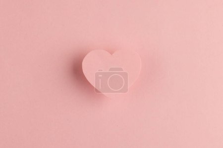 Photo for Elevated pink heart shape and shadow on pink background with copy space. Valentine's day, love, romance and celebration concept. - Royalty Free Image