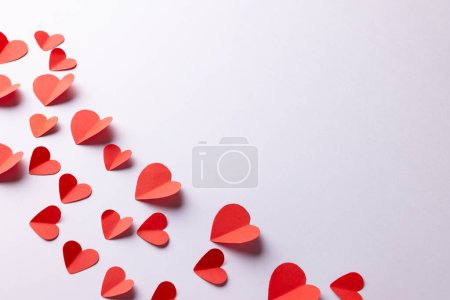 Photo for Red paper heart shapes on white background with copy space. Valentine's day, love, romance and celebration concept. - Royalty Free Image