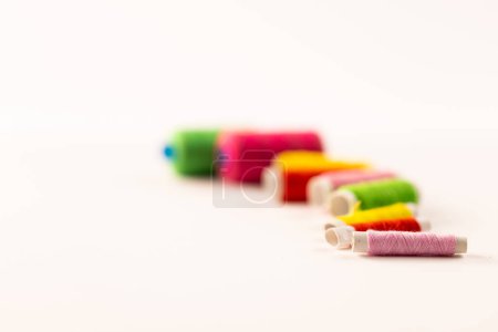 Photo for Composition of colourful sewing crewels on white background with copy space. National craft month, sewing, craft and needlework concept. - Royalty Free Image