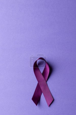 Photo for Vertical composition of purple add or adhd awareness ribbon on purple background, with copy space. Medical services, healthcare and mental health awareness concept. - Royalty Free Image