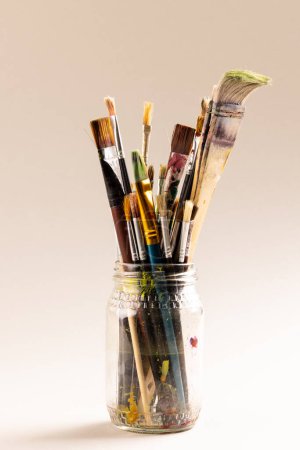 Photo for Composition of jar of painting brushes on white background with copy space. National craft month, painting, art and creativity. - Royalty Free Image