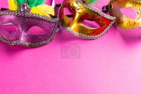 Photo for Composition of colourful mardi gras carnival masks on pink background with copy space. Party, celebration and carnival concept. - Royalty Free Image