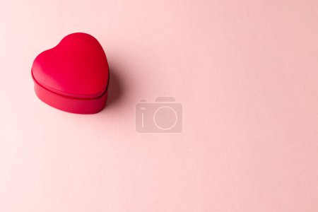 Photo for Red heart shaped box on pale pink background with copy space. Valentine's day, love, romance and celebration concept. - Royalty Free Image