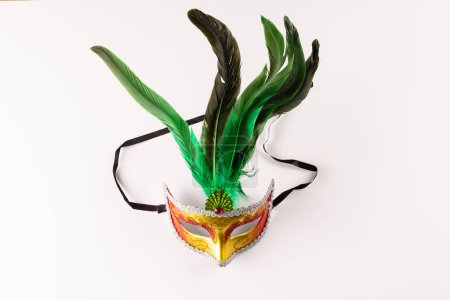 Photo for Composition of colourful mardi gras carnival mask with feathers on white background with copy space. Party, celebration and carnival concept. - Royalty Free Image