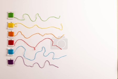 Photo for Composition of colourful sewing crewels on white background with copy space. National craft month, sewing, craft and needlework concept. - Royalty Free Image