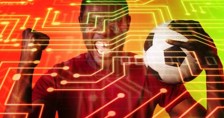 Photo for Illuminated connected dots over african american man with soccer ball screaming and shaking fist. Composite, sport, competition, soccer, fan, support, cheering, neon, match and abstract concept. - Royalty Free Image
