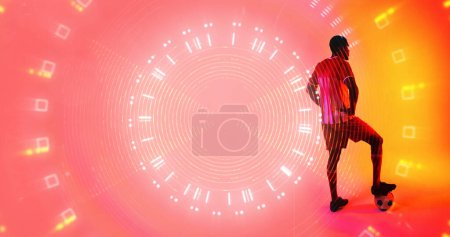 Photo for Illuminated squares, dots, lines in circular pattern over african american male player with ball. Copy space, composite, sport, competition, soccer, shape, match, neon and abstract concept. - Royalty Free Image