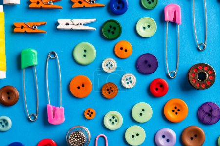Photo for Composition of sewing equipment on blue background. National craft month, sewing, clothes and copy space. - Royalty Free Image