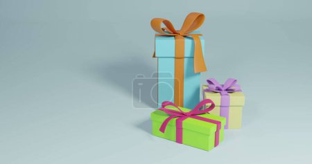 Photo for Image of three christmas presents spinning with copy space over grey background. Christmas, festivity, tradition and celebration concept. - Royalty Free Image