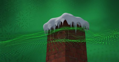 Foto de Ola digital verde sobre chimenea de pared de ladrillo cubierta de nieve contra copos de nieve sobre fondo verde. fiesta de Navidad y concepto de celebración - Imagen libre de derechos