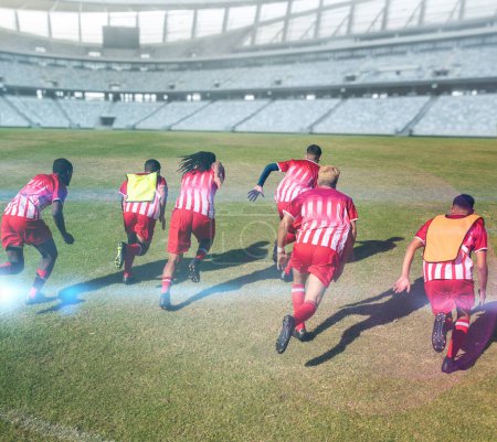 Photo for Rear view of multiracial male soccer players in sports clothing running in stadium. Sport, competitive sport, skill, athlete, match, teamwork. - Royalty Free Image