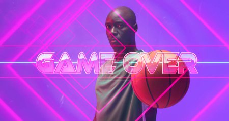 Photo for Composite of game over text with lines over bald african american player holding basketball. Portrait, copy space, the end, match, violet, sport, competition, illustration, shape and abstract concept. - Royalty Free Image